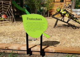 Cut to leaf shape interpretive on double pedestal in playground